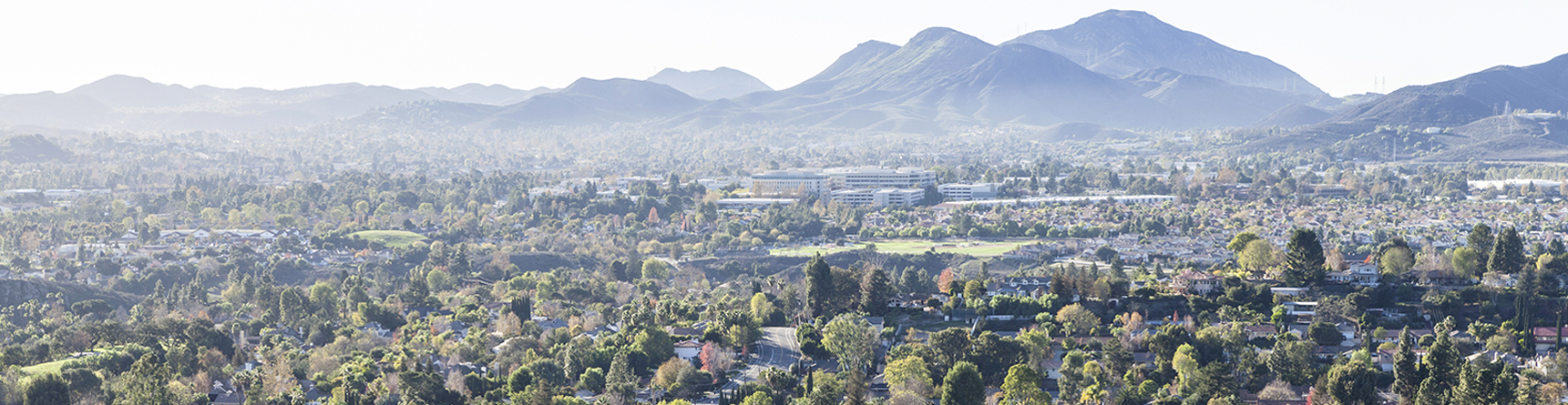 Aerial view of Brentwood area with Santa Monica Mountains in background